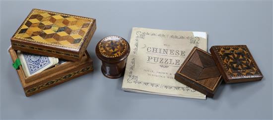 A Tunbridge Ware cylindrical nutmeg grater, a Tangram puzzle box with booklet and a small playing card box